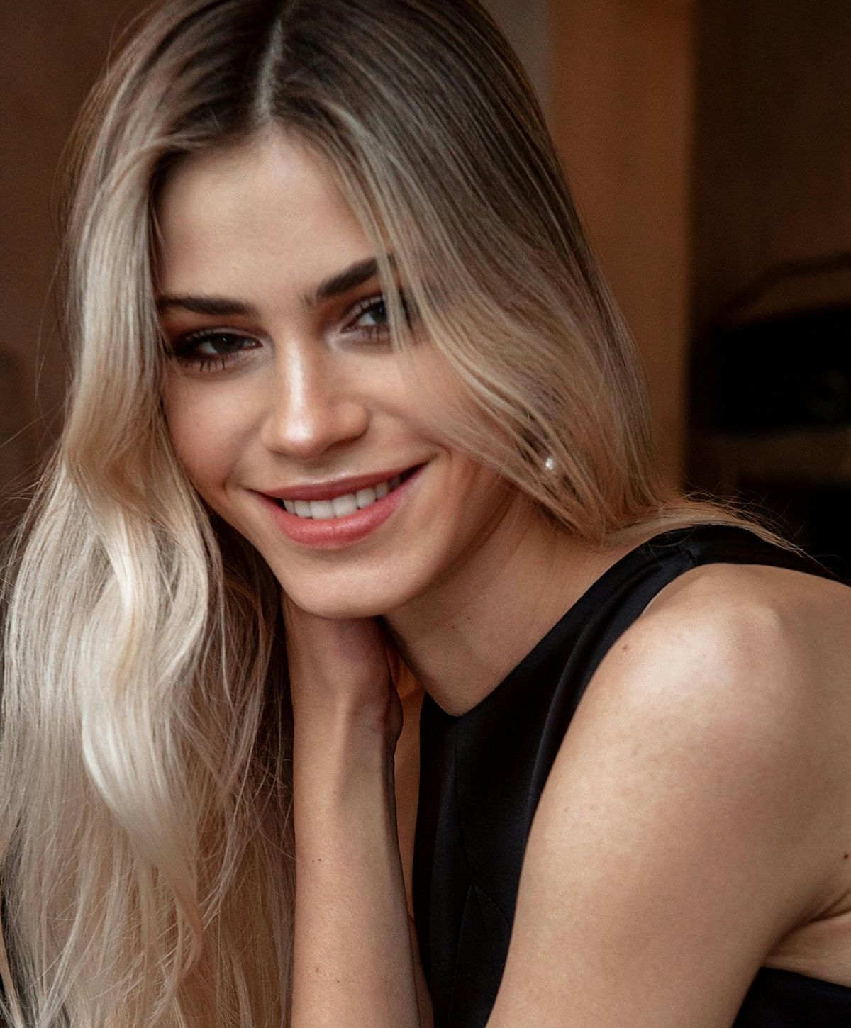 Smiling woman with long blonde hair.