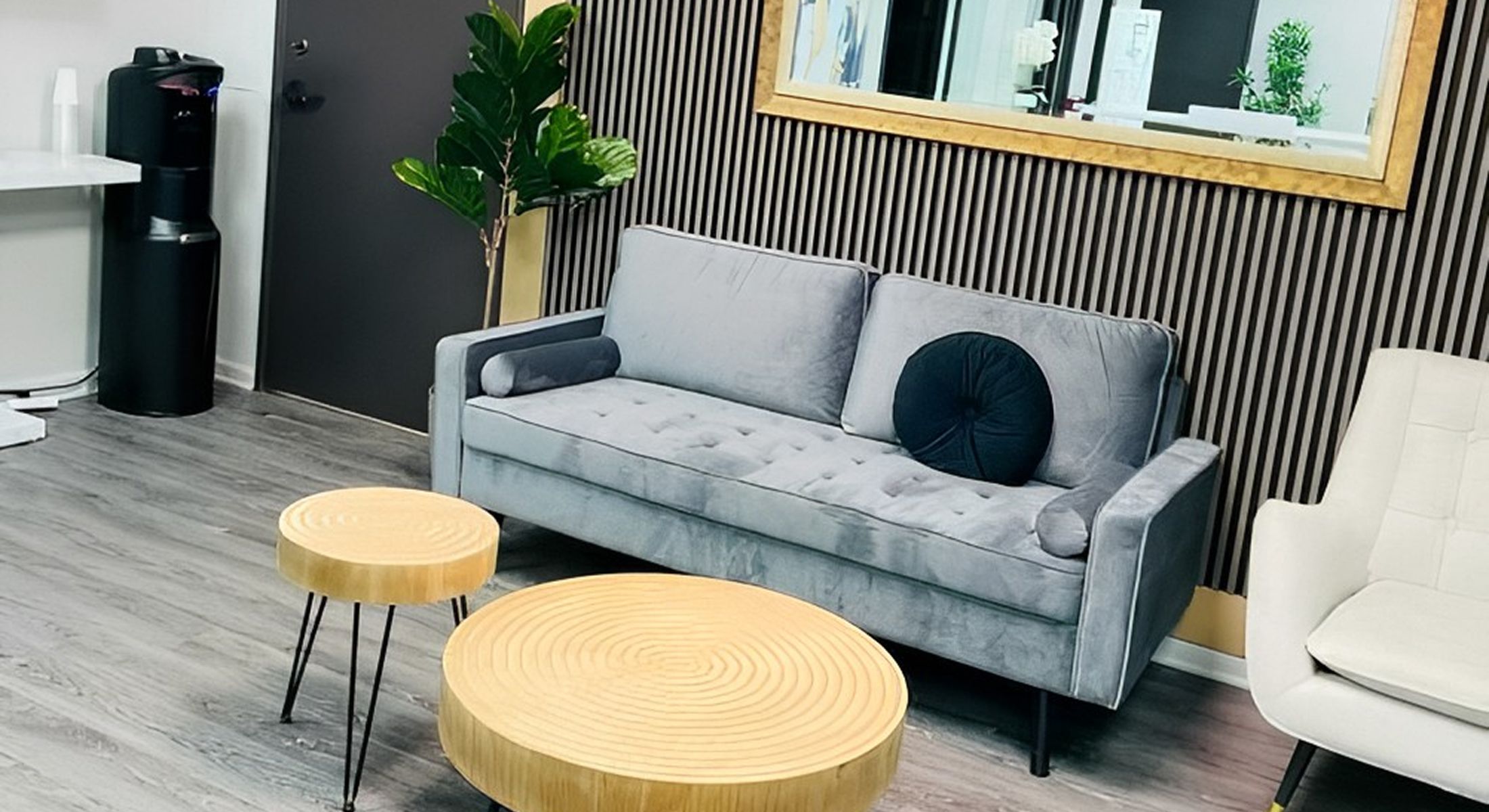 Modern waiting area with stylish furniture and decor.