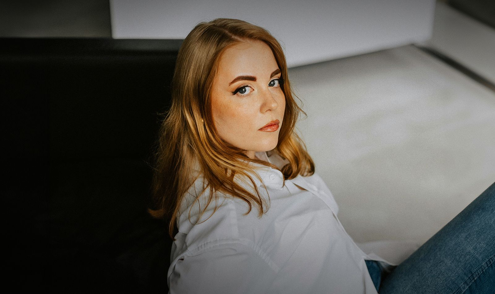 Woman with long hair in a casual outfit.