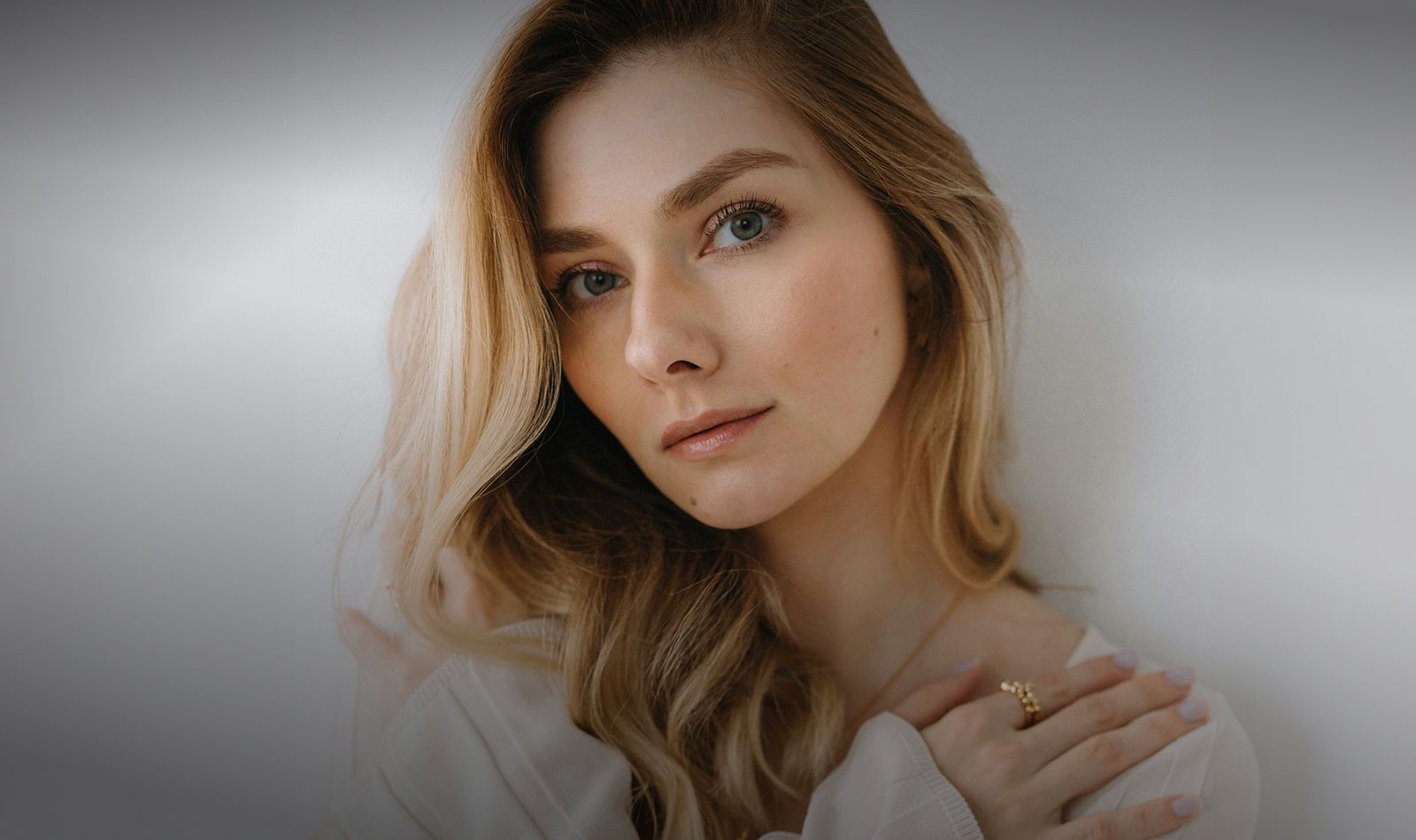 Portrait of a woman with long blonde hair.