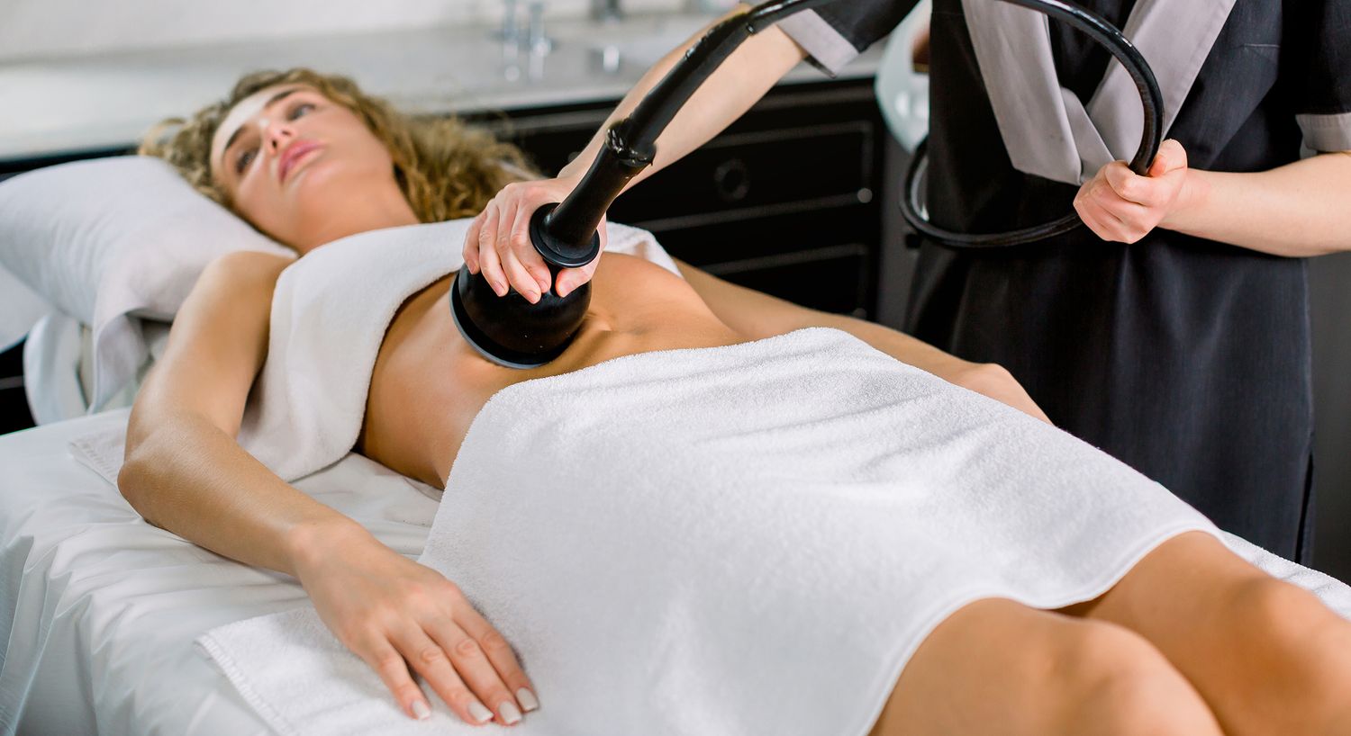 Woman receiving a body treatment in a spa.